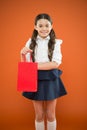 Girl holding shopping bag. Prepare for school season buy supplies stationery clothes in advance. School uniform formal