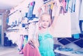 Girl holding shopping bags in children clothes