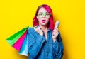 Girl holding shopping bags with money Royalty Free Stock Photo