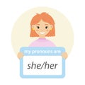 Girl holding sign with gender pronoun.