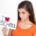 Girl holding a sign with the words I hate school