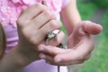 Girl holding a small lizard in her hands, closeup hands, selective focus, Royalty Free Stock Photo