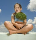 Girl holding small tree Royalty Free Stock Photo