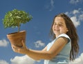 Girl holding small tree Royalty Free Stock Photo