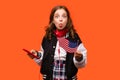 Girl holding small USA flag Royalty Free Stock Photo