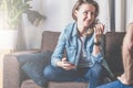 A girl holding a smartphone. Teamwork, discussion a business plan.