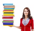 Girl holding stack color book .