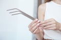 Girl is holding stainless steel straws to reduce the amount of plastic waste in the environmen