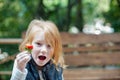 Girl holding strawberries