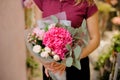 girl holding a stylish bouquet of pink roses, hydrangea, eucalyptus Royalty Free Stock Photo