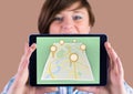 Girl Holding tablet and Map of City with marker location pointers Royalty Free Stock Photo