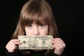 Girl holding ten dollar bill Royalty Free Stock Photo