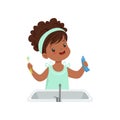 Girl holding tooth paste and toothbrush, cute kid brushing her teeth in bathroom vector Illustration on a white Royalty Free Stock Photo