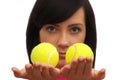 Girl holding two tennis balls Royalty Free Stock Photo