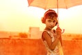 Girl holding umbrella in beautiful gown Royalty Free Stock Photo