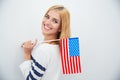 Girl holding USA flag Royalty Free Stock Photo