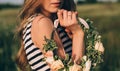 Girl holding a wedding wreath