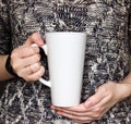 Girl is holding white Latte Mug in hands. Womans gift. Mockup for designs