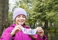 Girl holding white paper boat called peace Royalty Free Stock Photo