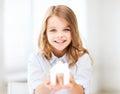 Girl holding white paper house Royalty Free Stock Photo