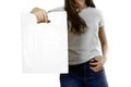 Girl holding a white plastic bag. Close up. Isolated background Royalty Free Stock Photo