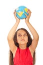Girl holding world globe over head Royalty Free Stock Photo