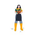 Girl holds a box with fresh organic vegetables. Girl works on the farm. Organic healthy food, farmer`s market. Cartoon Royalty Free Stock Photo