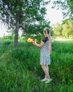 Girl holds a burning book in her hands. A young woman in a forest burns a book Royalty Free Stock Photo