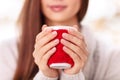 Girl holds the cup in cute cupholder