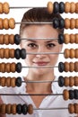 Girl holds in front of abacus Royalty Free Stock Photo