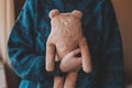A girl holds in hand a teddy bear Royalty Free Stock Photo