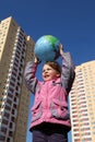 Girl holds in hands balloon in form of globe Royalty Free Stock Photo