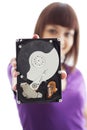 A girl holds a hard disk Royalty Free Stock Photo