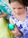 Girl Holds Her Dyed Green Easter Egg