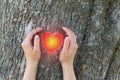 Girl holds her hands in protection gesture for saving nature.