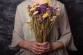 Girl holds immortelle flowers Royalty Free Stock Photo