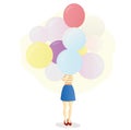 girl holds a large armful of colorful balloons Royalty Free Stock Photo