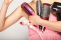 Girl holds many accessories for hair styling