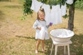 The girl holds an open bottle of liquid detergent in hand.  hand wash Royalty Free Stock Photo