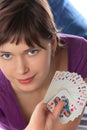 Girl holds a pack of playing cards Royalty Free Stock Photo