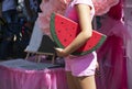 Girl holds a pillow in the shape of a wedge of watermelon