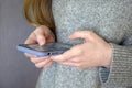 Girl holds samrtphone in her hands