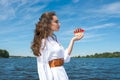 Girl holds a small ship with red sails. Modern Assol. Royalty Free Stock Photo