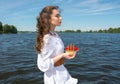 Girl holds a small ship with red sails. Modern Assol. Royalty Free Stock Photo