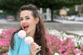 Girl holds a stick with two marshmallows Royalty Free Stock Photo