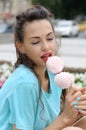 Girl holds a stick with two marshmallows Royalty Free Stock Photo