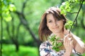 Girl holds a tree branch