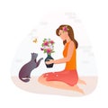 Girl holds a vase with flowers in her hands. The cat is smelling flowers. Royalty Free Stock Photo