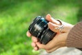 The girl holds a vintage lens in hand Royalty Free Stock Photo