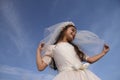 Girl in Holy Communion Dress and veil